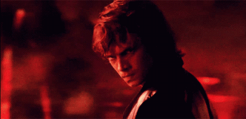 Anakin reacting as Obi-Wan says, “It was said that you would destroy the Sith, not join them.”